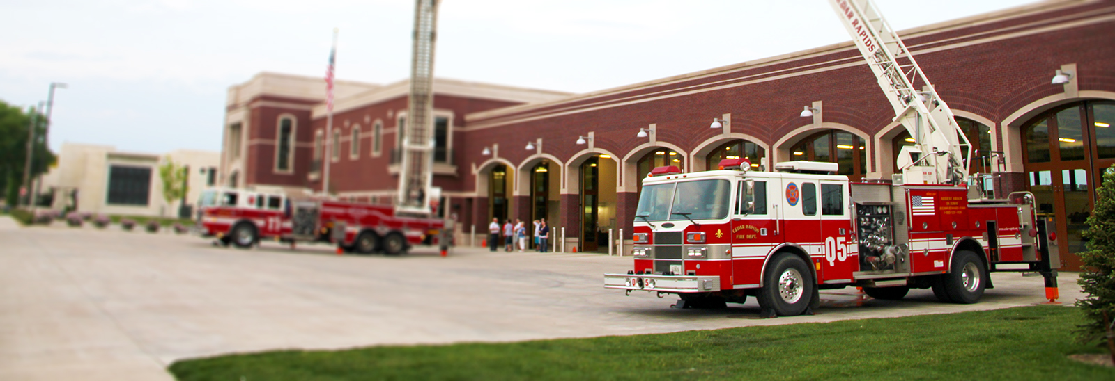 Fire trucks parked outside of the fire station.