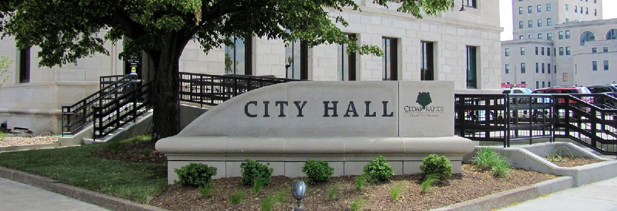 Stone sign that reads City Hall