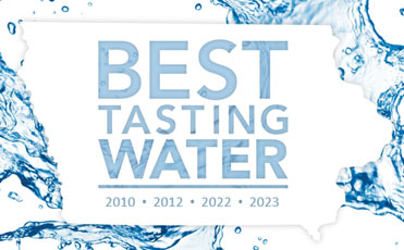 State of Iowa with the text Best Tasting Water - 2010, 2012, 2022, 2023 - shown in front of a splash of water background image