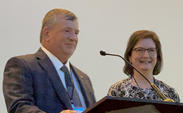 Roy Hesesmann receives the Fuller award beside his wife Karen.