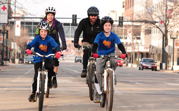 family biking downtown